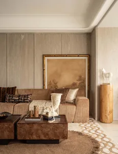 A modern living room with wooden furniture, including a sofa, coffee tables, and decorative items.