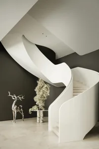A sleek, modern staircase made of white marble.