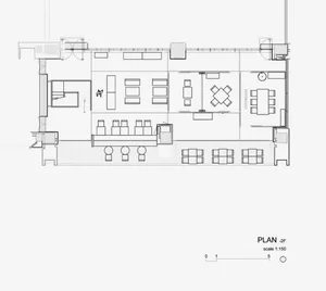 A black and white floor plan of a modern restaurant showing seating arrangements, dining tables, and kitchen layout.