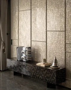 A modern living room with black steel accents and metallic finishes.