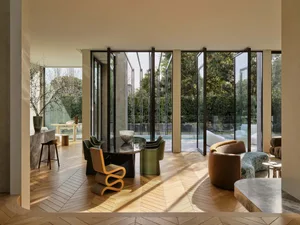 Modern living room with wood, concrete, marble, and glass materials.