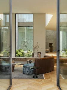 Modern living room featuring a wooden floor and contemporary furniture.