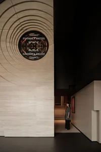 A modern lobby with concrete and wooden elements.