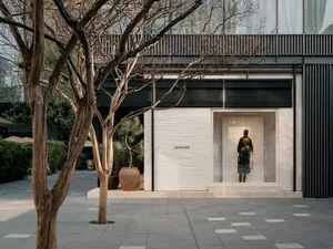 A modern retail storefront with mixed materials and a minimalist design.
