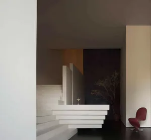 Modern hotel lobby with white marble reception desk and minimalist design