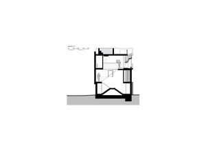 An architectural drawing of a residential interior with a white-painted floor plan and a staircase.