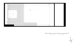 Minimalist bedroom floor plan with a bed, bed frame, and white walls.