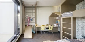 A modern indoor design room with wooden surfaces and contemporary furniture.