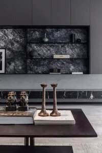 A modern interior design featuring marble and metal elements.