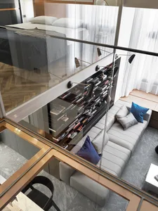 A modern living room featuring a built-in bookshelf with books and a comfortable sofa.