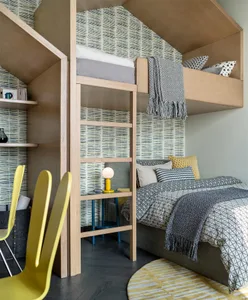 A modern residential interior featuring a bunk bed with wooden frames and printed textiles, a single bed with geometric patte