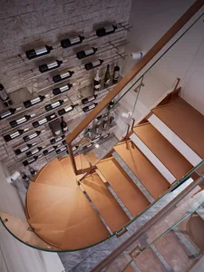 Modern wooden staircase with glass railing.