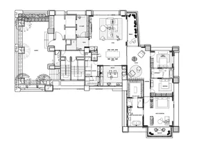 Floor plan of a modern residential apartment with multiple rooms and outdoor areas.