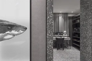 Modern black and white clothing retail store featuring a minimalist interior with a terrazzo floor and minimalist decor.