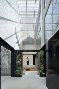 Interior design featuring modern glass, steel, and concrete elements