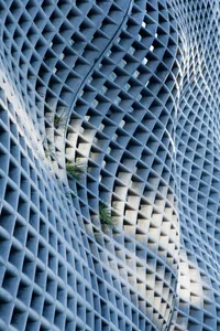 Close-up view of a modern architectural design featuring geometric patterns and concrete material.