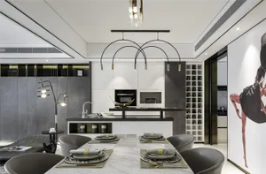 Modern kitchen with marble countertops, glass cabinets, and a white center island.