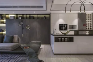 Modern living room and kitchen area with metallic accent materials and minimalist design.