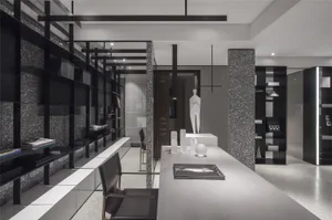 Modern office space with black and white decor, featuring a contemporary interior design.