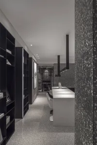 A modern office space featuring a unique terrazzo floor, designed with sleek lines and a minimalist aesthetic.
