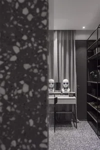 A modern wardrobe featuring a terrazzo floor and minimalist design.