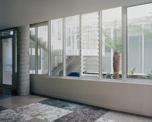 Modern interior with concrete floor and large windows