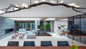 Modern living room featuring a concrete floor, contemporary furniture, and minimalist design elements.