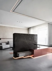 A modern office space with a concrete countertop and minimalist design.