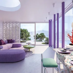 A modern residential interior with purple, green, and white decor and furniture.