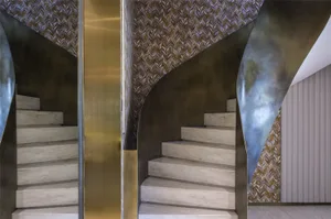 Modern staircase with a wooden texture in a contemporary interior design setting.