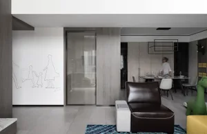 A modern living room with concrete walls and a minimalist design.