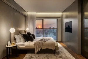 Modern minimalist bedroom featuring a comfortable bed with white linens and mixed-media materials, set against a backdrop of 