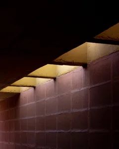 Modern wall with concrete blocks and warm light.