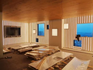 Construction site featuring modern interior build with metal planks.