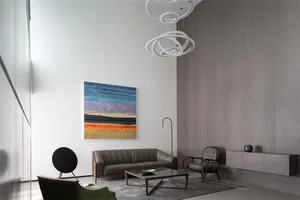 Modern living space featuring metal, leather, wood, and glass materials