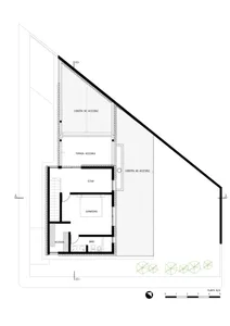 A floor plan of a modern hillside house showing the layout of the interior spaces, including a living room, bedroom, bathroom