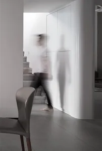 A minimalist interior design featuring concrete elements and clean, simplistic lines.