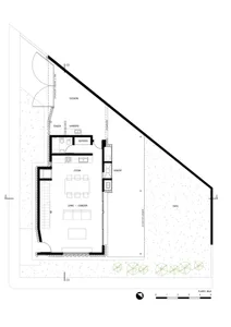 Floor plan of a residential layout with a living room, dining room, kitchen, and additional spaces.