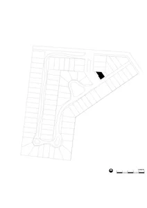 A black and white architectural site plan with scale and directional compass.