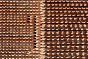 A textured brick wall pattern with varied shading