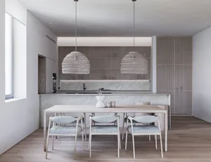 Minimalist kitchen and dining space with marble accents and wooden furniture.