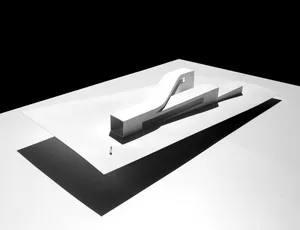 A modern architectural model made of plastic features clean lines and minimalist design.