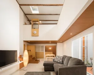 Modern living room with wood accents and minimalist design.