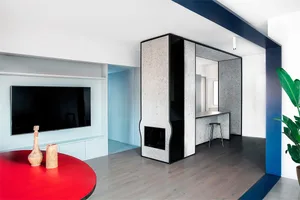 A modern minimalist living room with concrete surfaces and wooden accents.