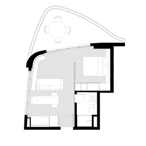 A minimalist apartment floor plan layout featuring open living and dining areas, a kitchenette, a bedroom, and a bathroom.