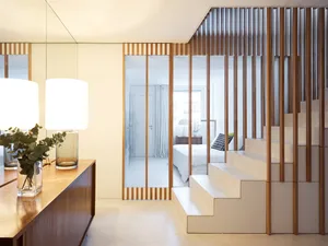 Modern minimalist interior with white space, clean lines, and natural materials.