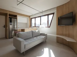 Modern living room featuring light wood finishes and contemporary design elements.