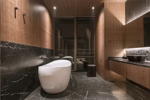 Modern bathroom with marble and walnut materials.