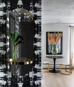 A modern entry way featuring glass, metallic accents, and botanical decor.