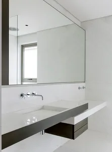 Modern bathroom with marble countertop and white marble walls